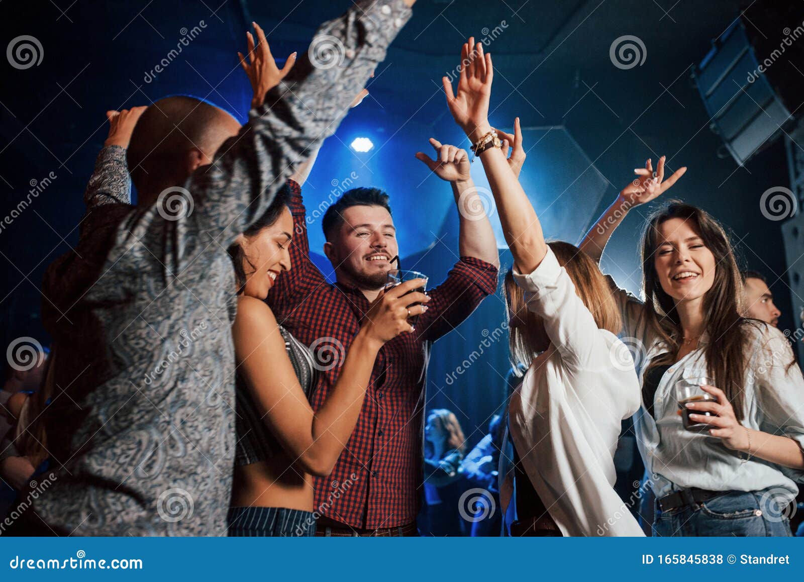 Raise Your Hands Up. Happy People Dancing in the Luxury Night Club ...