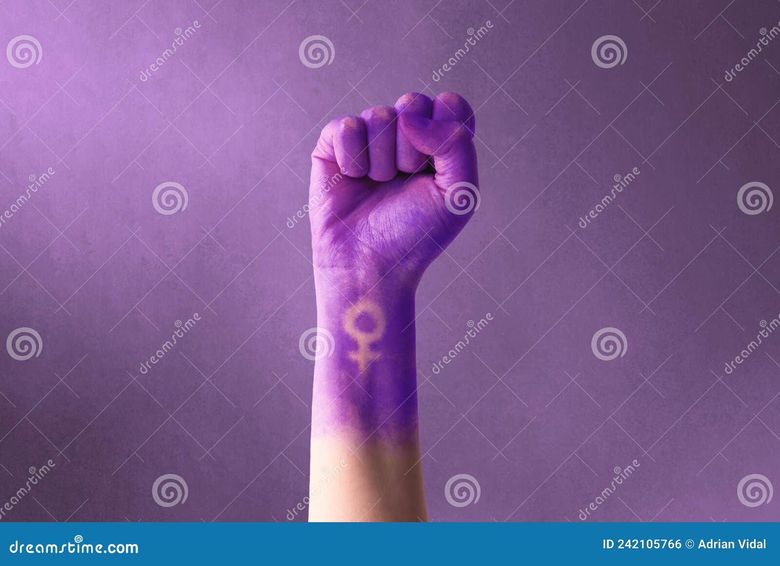 raised purple fist of a woman for international women`s day and the feminist movement. march 8 for feminism, freedom