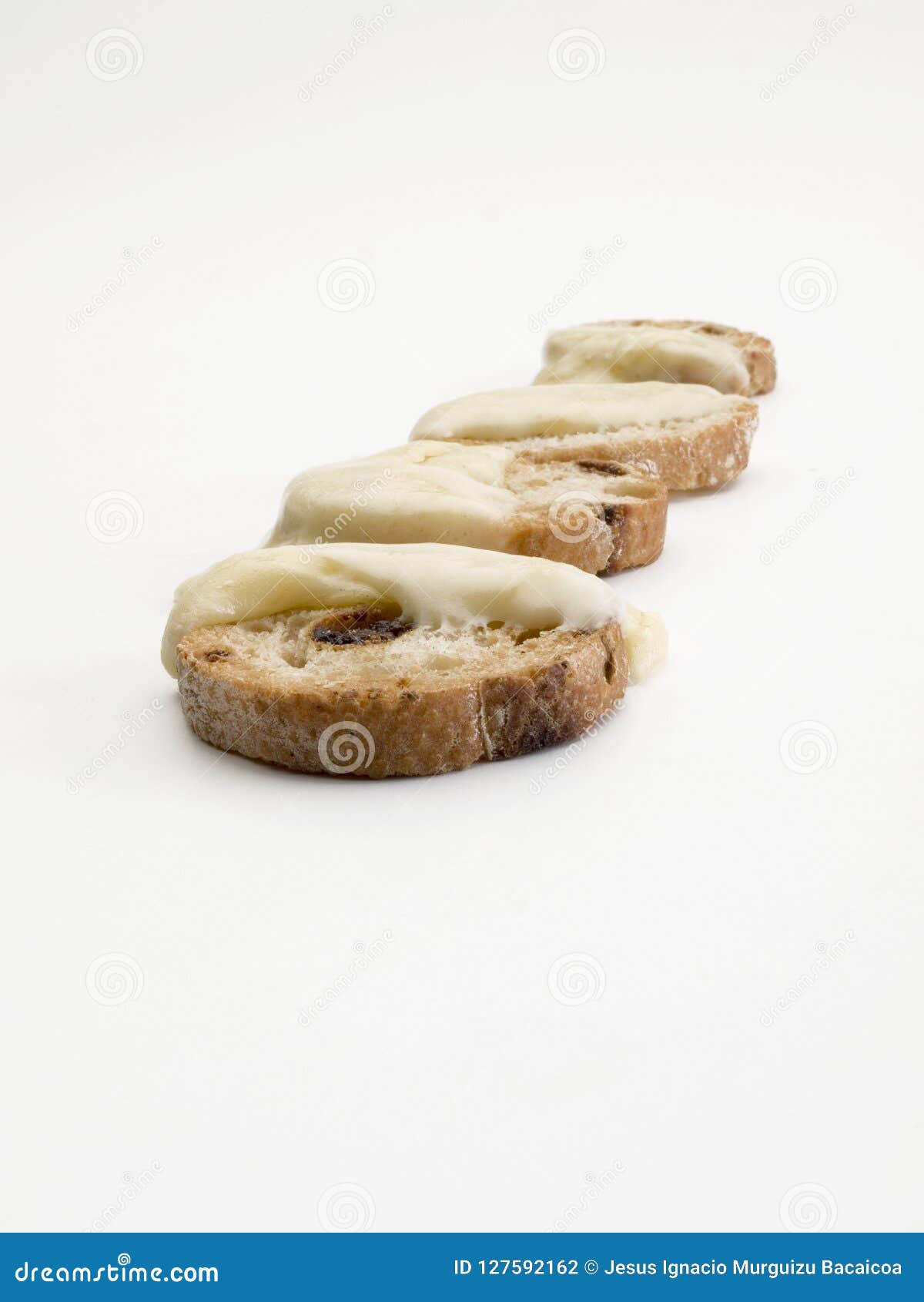 raisin bread toast with melted cheese on them