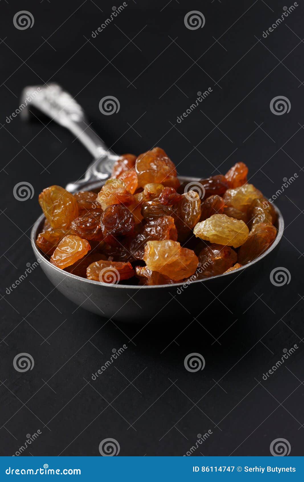 Raisins in steel spoon stock image. Image of sugar, carbohydrates