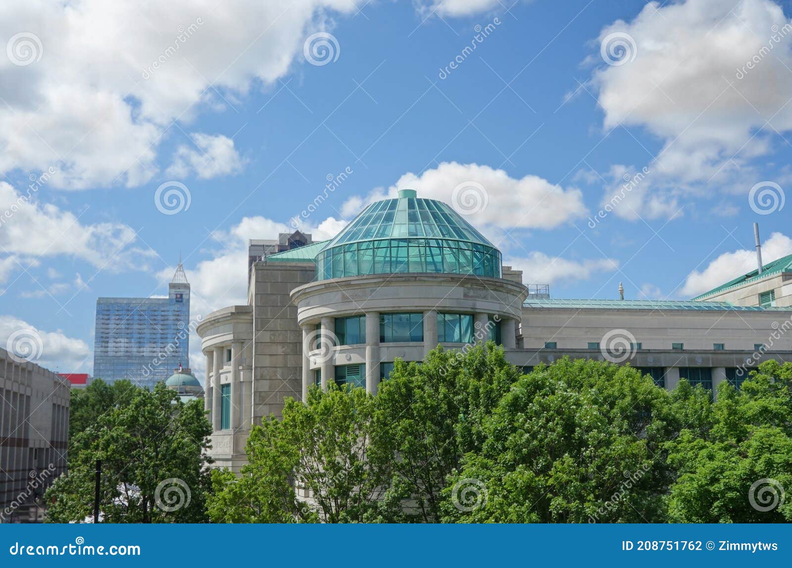 raleigh nc skyline with the museum of natural sciences glass dome in the foreground