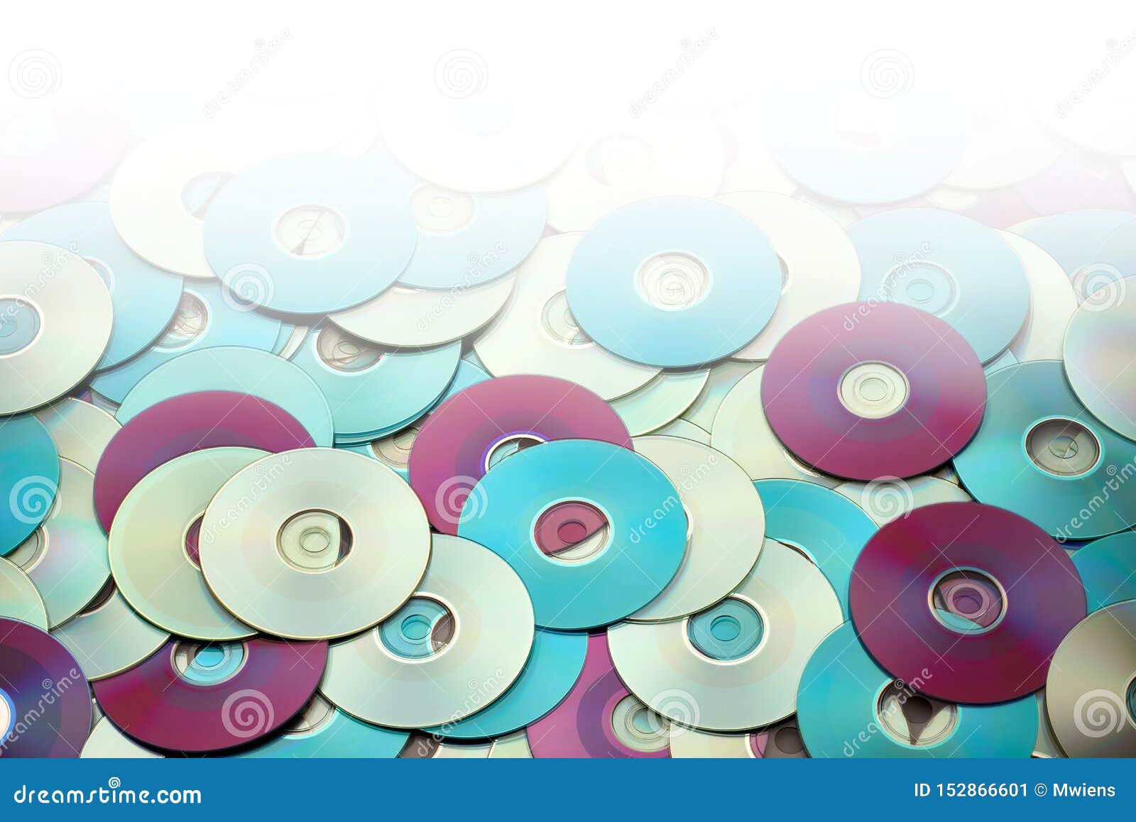 Random Arrangement Of Metallic DVD And CD Data Storage Disks Stock random-arrangement-of-metallic-dvd-and-cd-data-storage-disks-stock