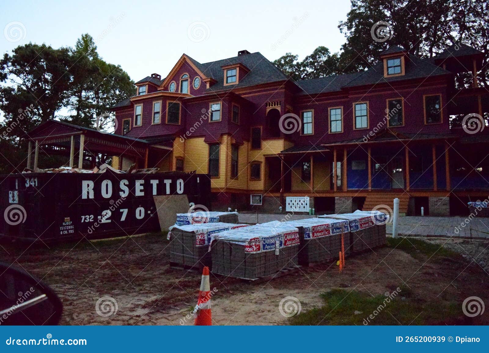 A New Home That Is Under Construction With Brick Pavers In The Driveway