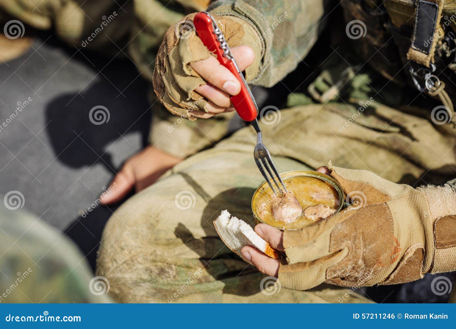 Rangers are Heated Food on the Fire and Eat in the Forest Stock Photo