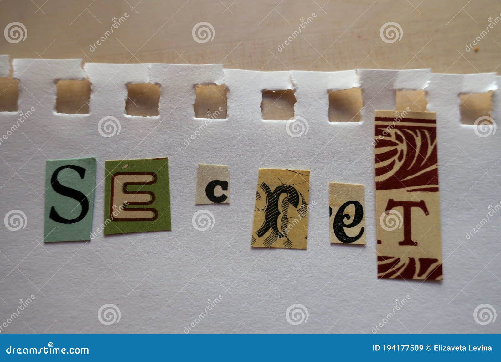 ransom note style collage saying secret on a sheet of white paper torn out of a notebook