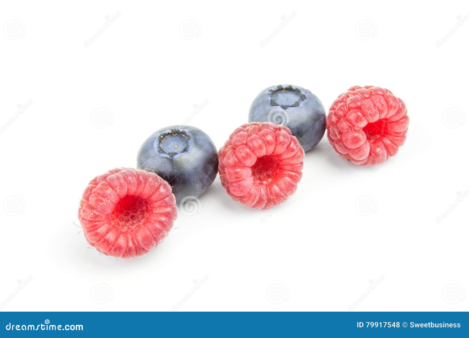 Raspberries and Blueberries in Row Isolated on White Stock Photo