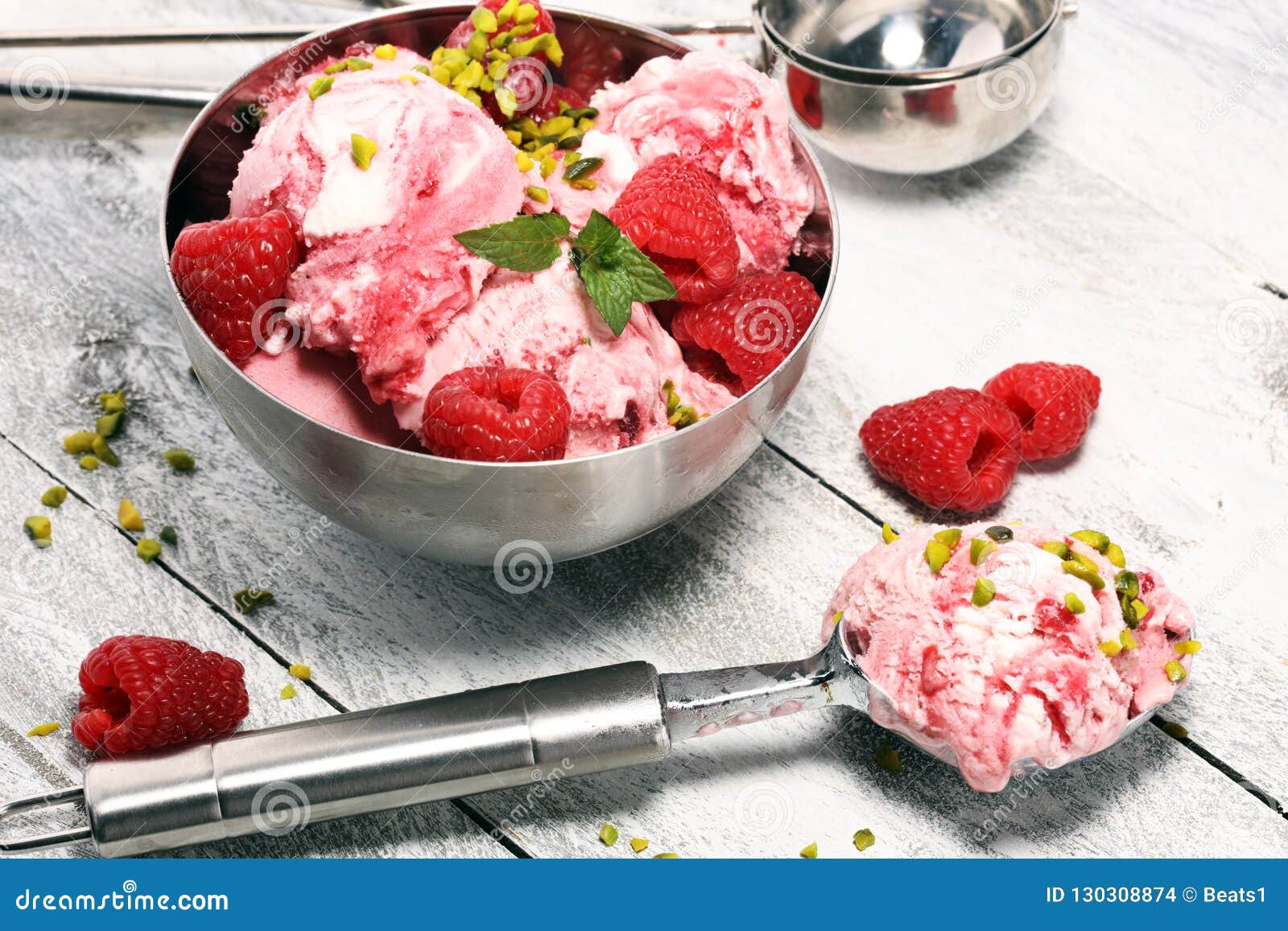Raspberry Ice Cream Scoop With Chopped Nuts And White Chocolate Stock