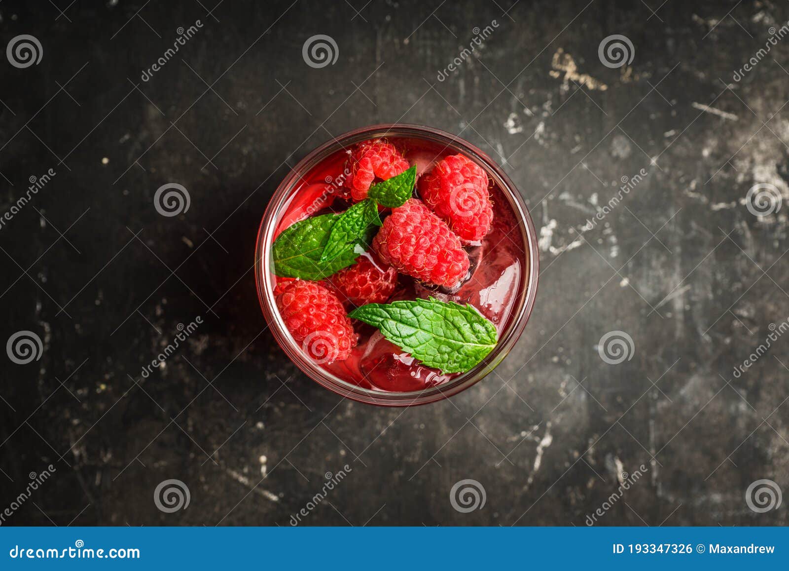 Raspberry and Mint Cocktail in Glass on the Rustic Background Stock