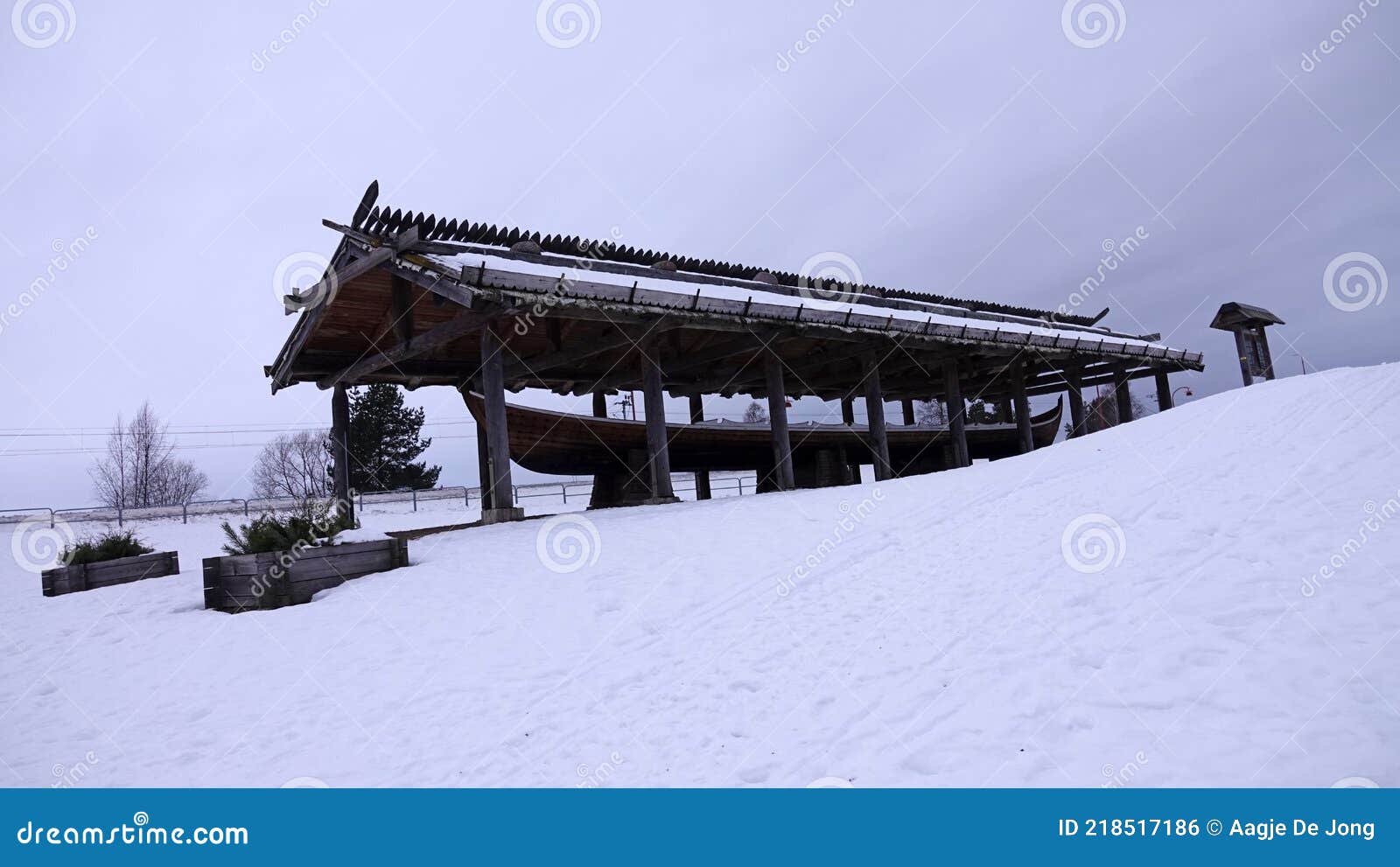 rattvik church boat next to frozen lake siljan in dalarna in sweden