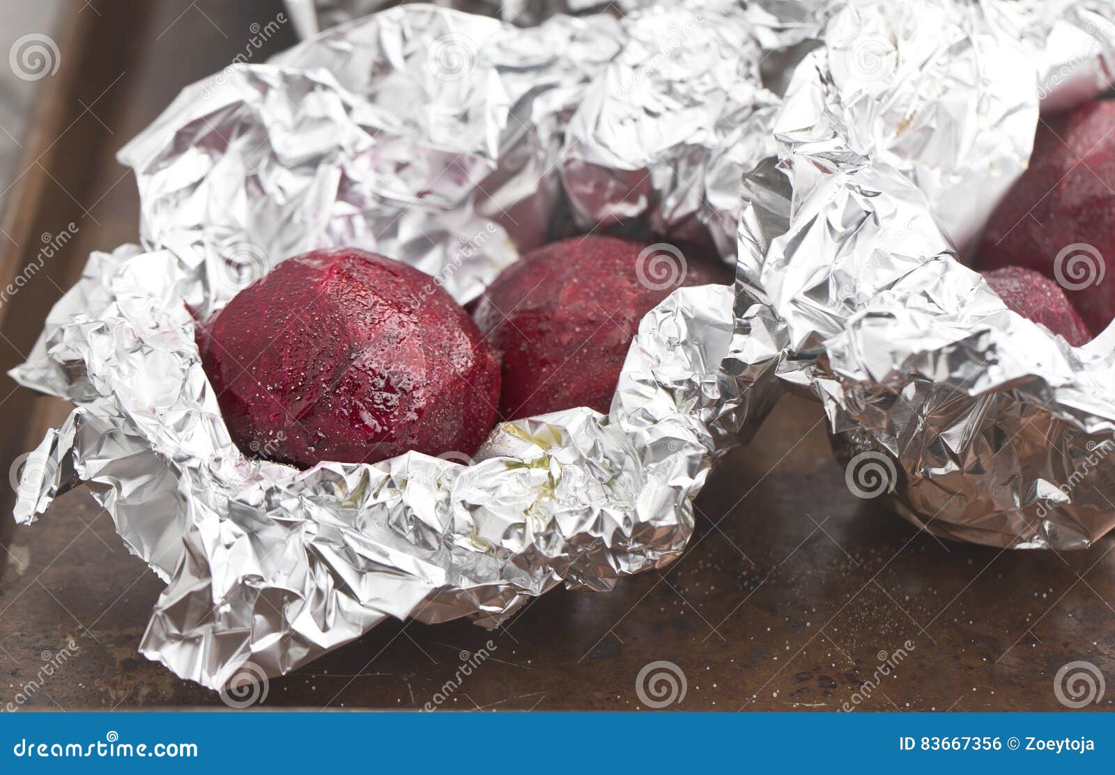 Raw Beats with Salt and Pepper Wrapped in Aluminum Foil Stock Photo
