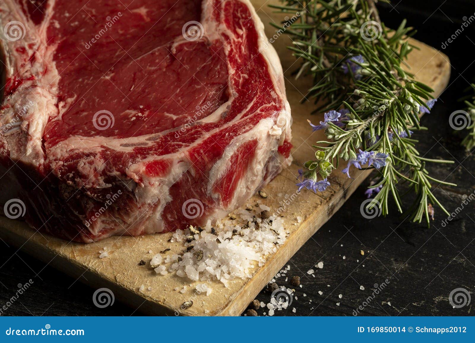 A Raw Beef Chop on a Chopping Board Stock Photo - Image of uncooked ...