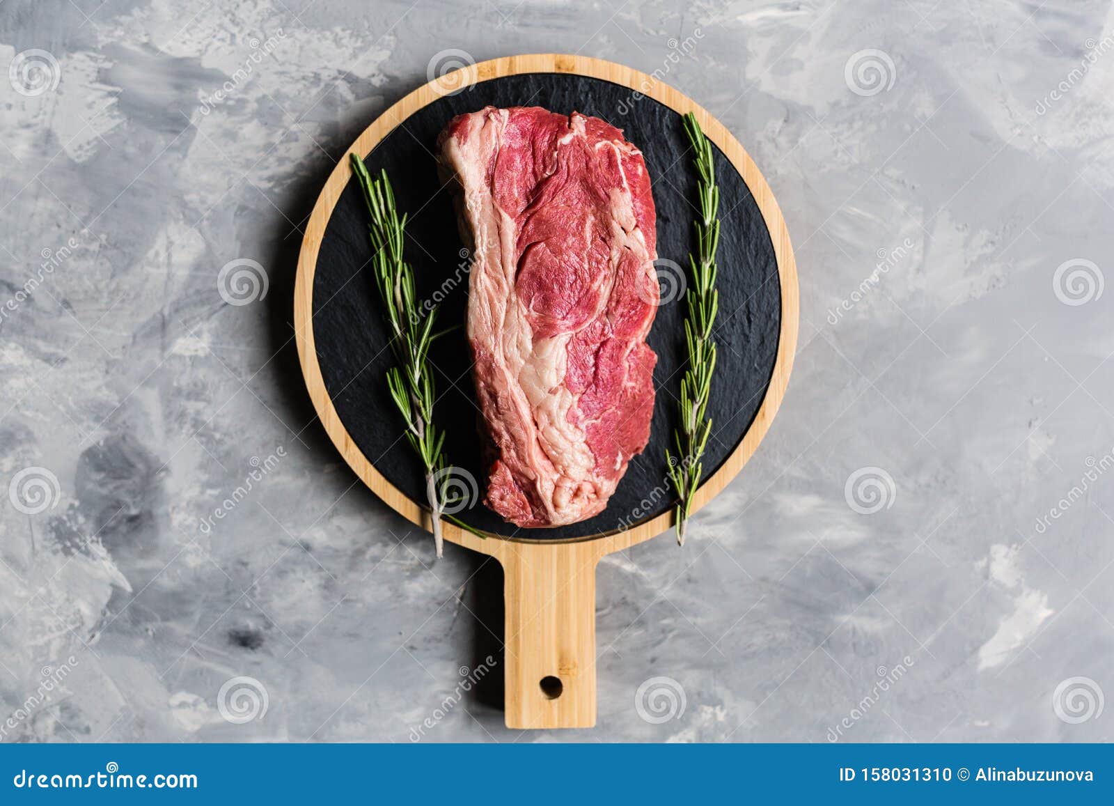 Download Raw Meat Beef On A Cutting Board With Rosemary And Spices ...