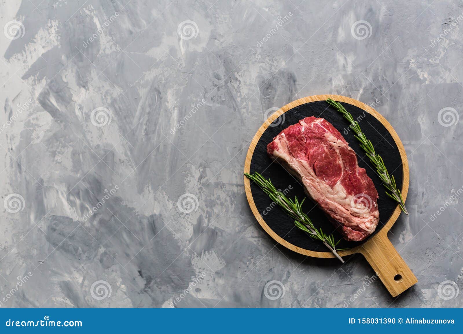 Download Raw Meat Beef On A Cutting Board With Rosemary And Spices ...