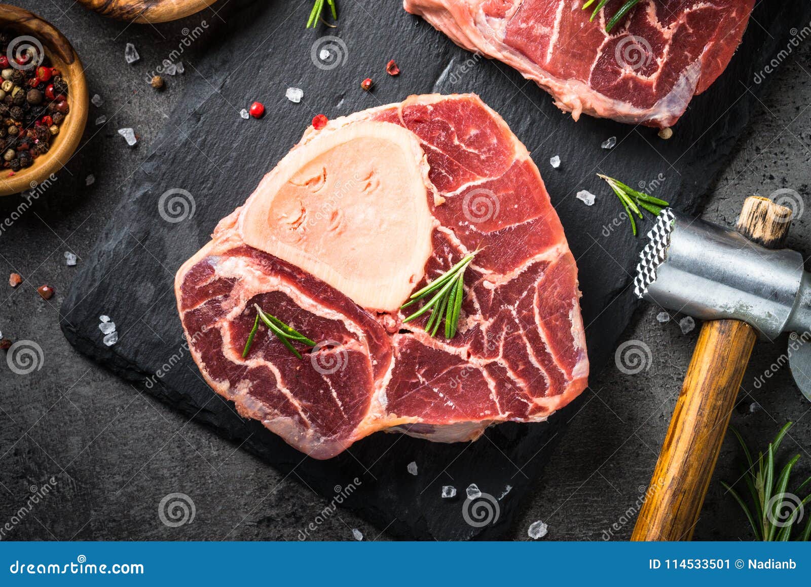 raw beef steak osso bucco on black. marble meat.