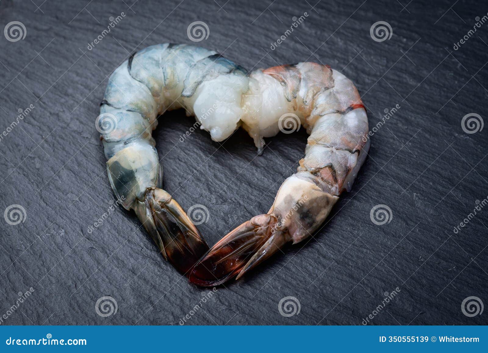 raw big tiger ( king ) shrimps in form heart  photography . top view