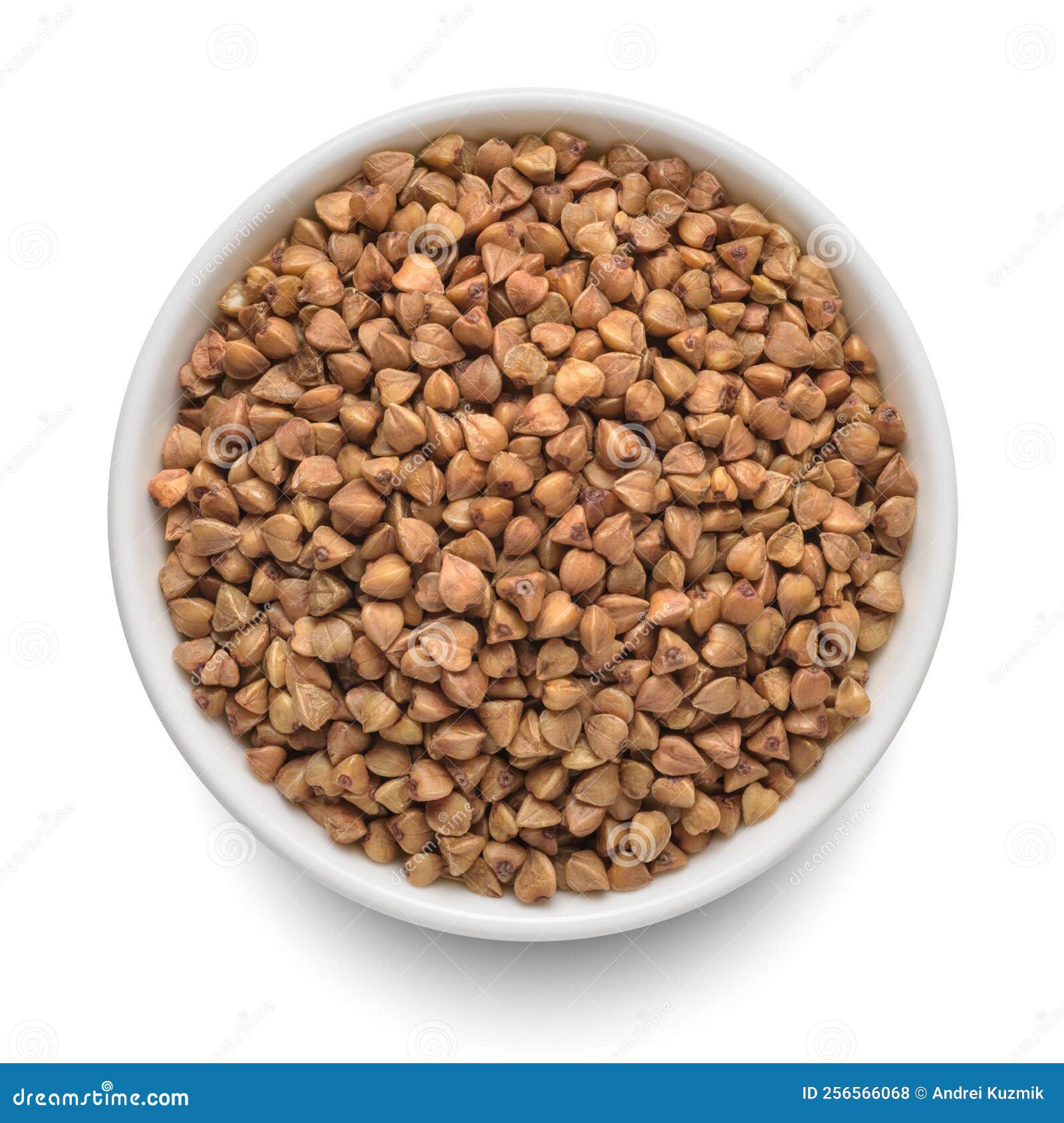 Raw Buckwheat in White Bowl Isolated on White. Top View Stock Photo