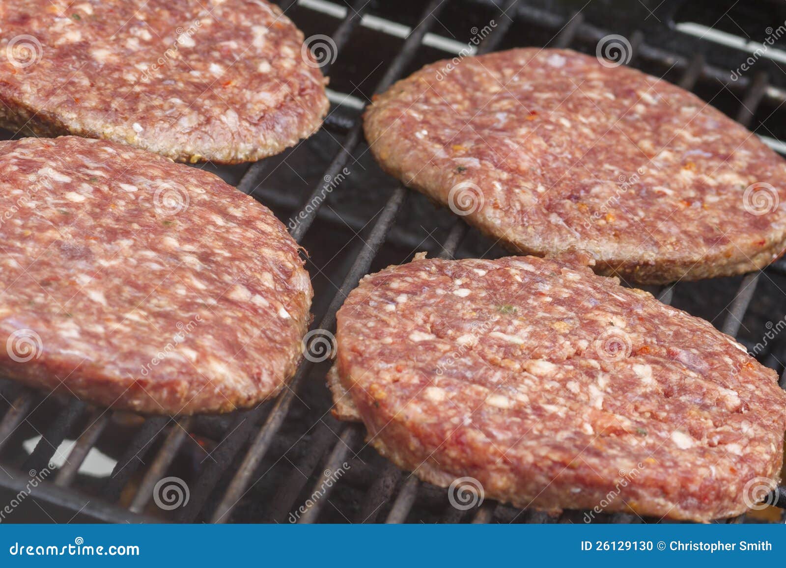 Raw Burgers on a Barbecue stock photo. Image of flame 26129130