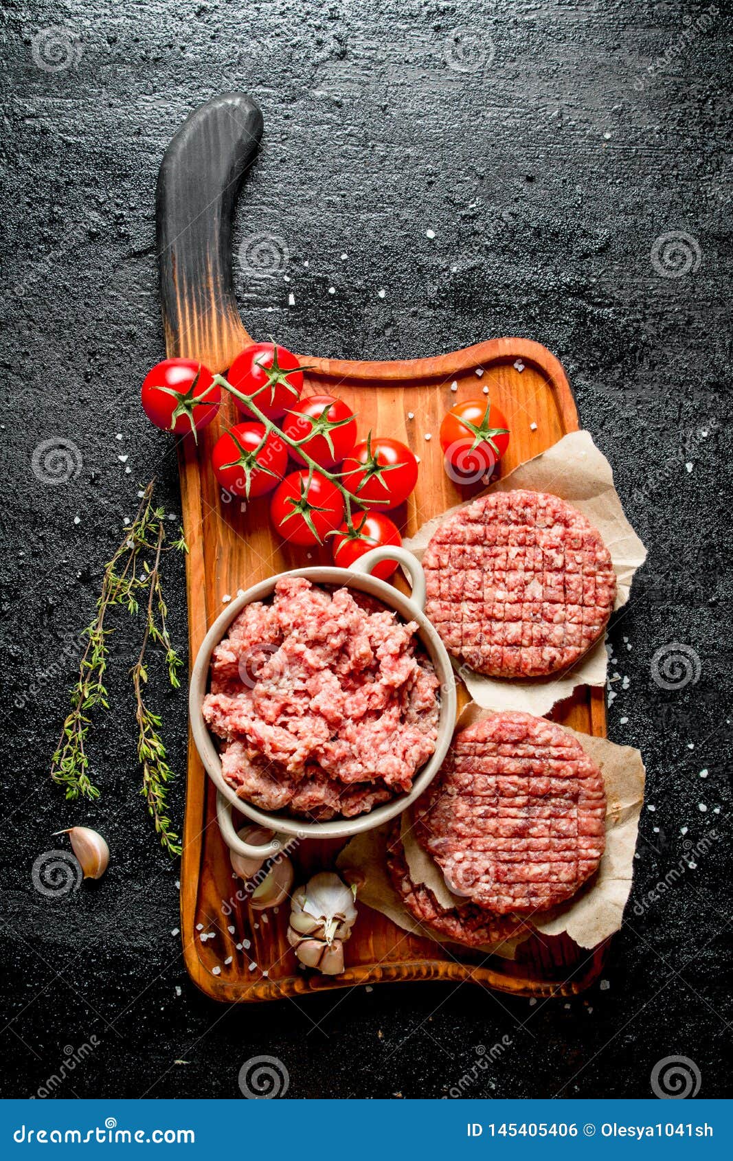 Raw Burgers and Ground Beef with Tomatoes, Garlic Cloves and Thyme Stock Photo Image of
