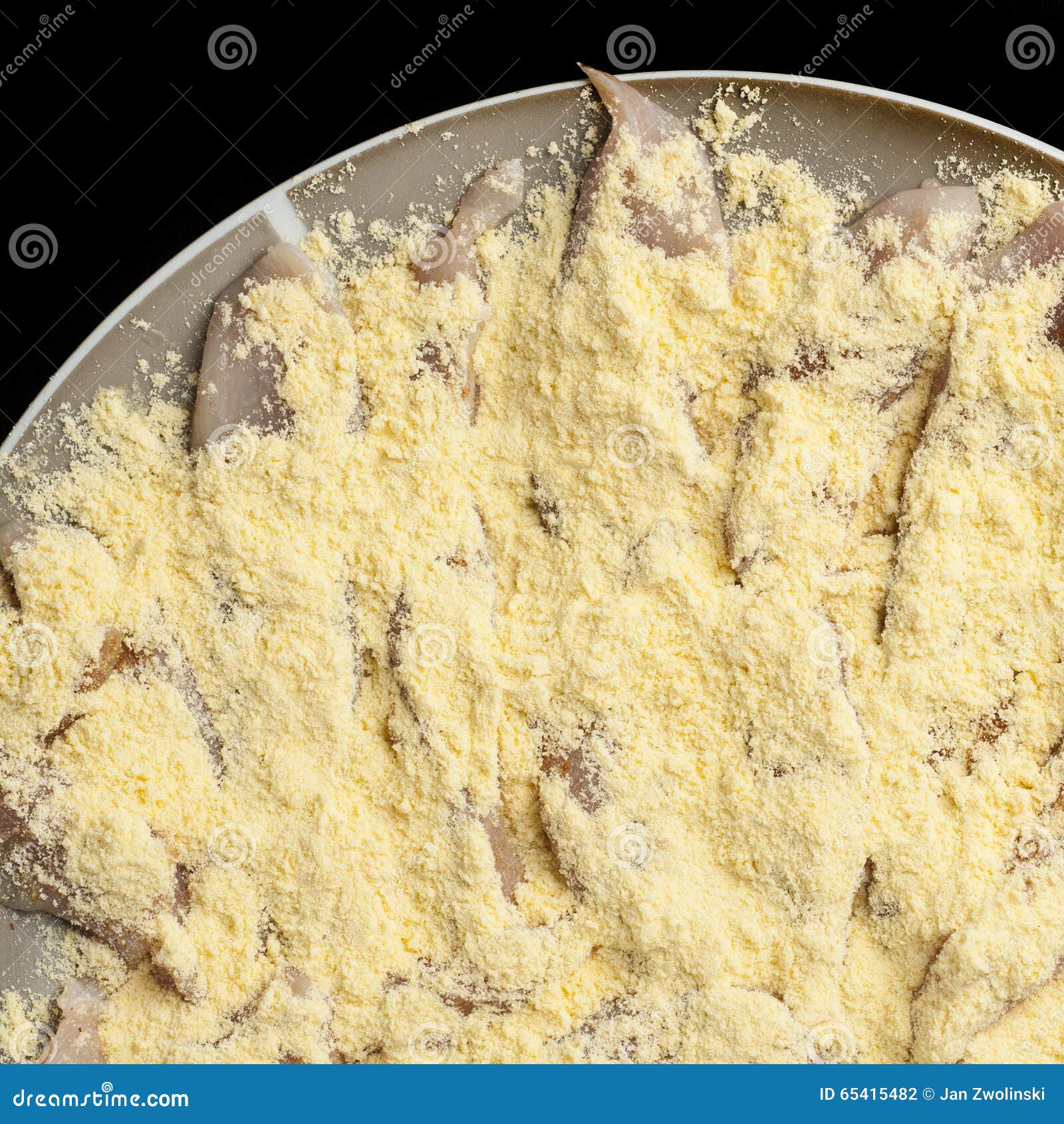 Raw Chicken Breast Sliced into Strips Powdered with Corn Flour Stock