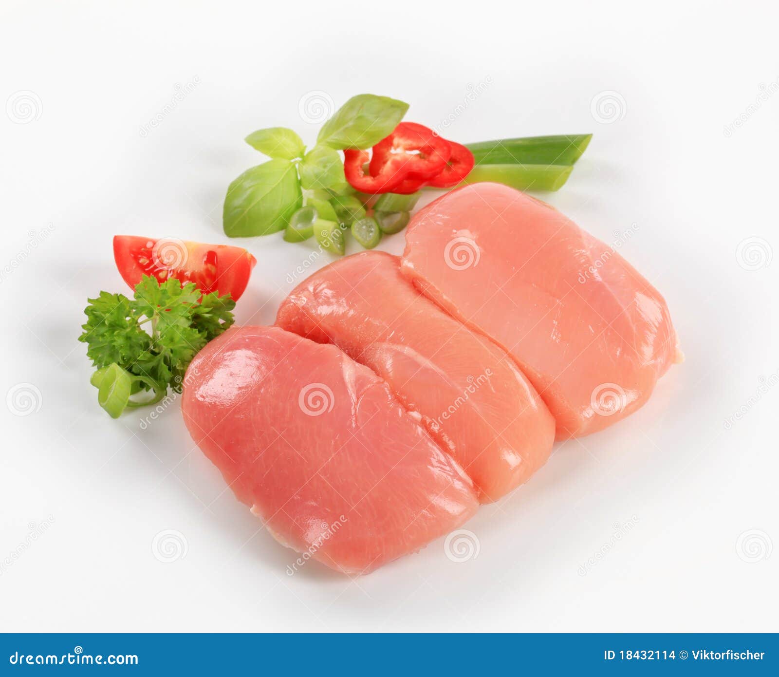 Raw chicken breasts. Raw chicken breast fillets and fresh vegetables