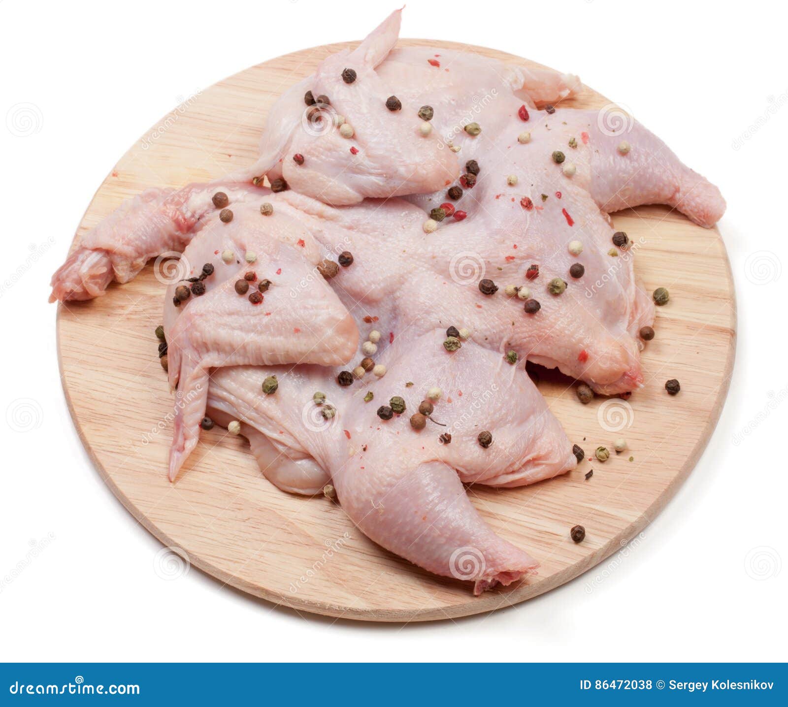 Raw Chicken Carcass on the Cutting Board Isolated on White Background