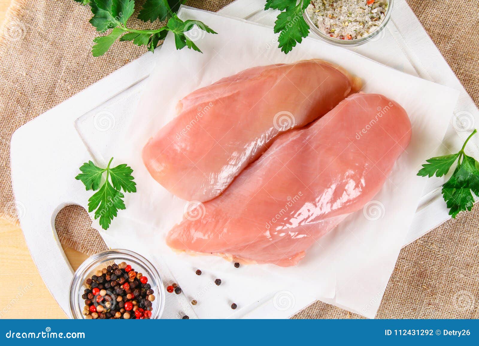 Raw Chicken Fillets on Wooden Cutting Board. Stock Photo Image of