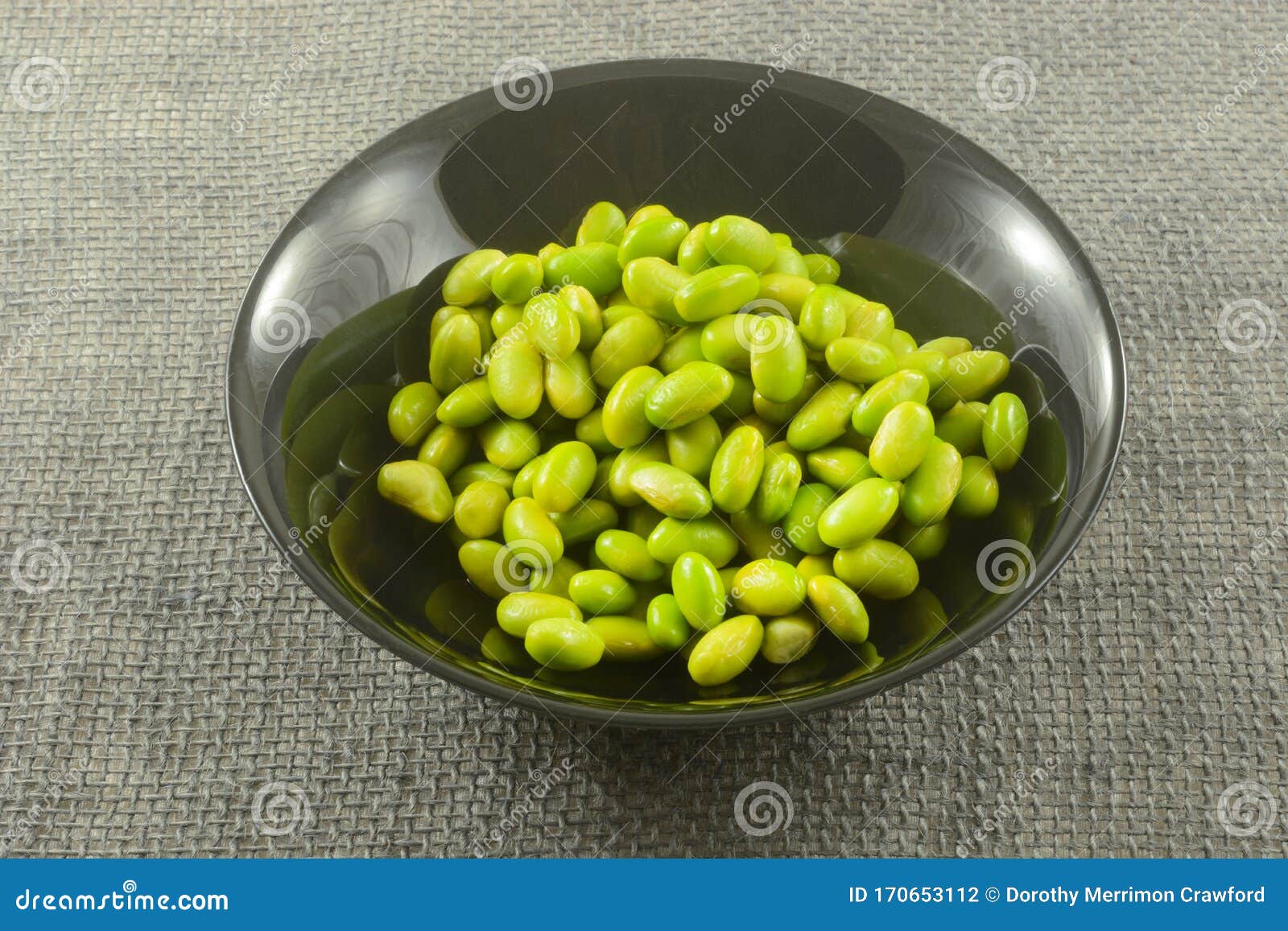 Raw Edamame in black bowl stock photo. Image of protein - 170653112