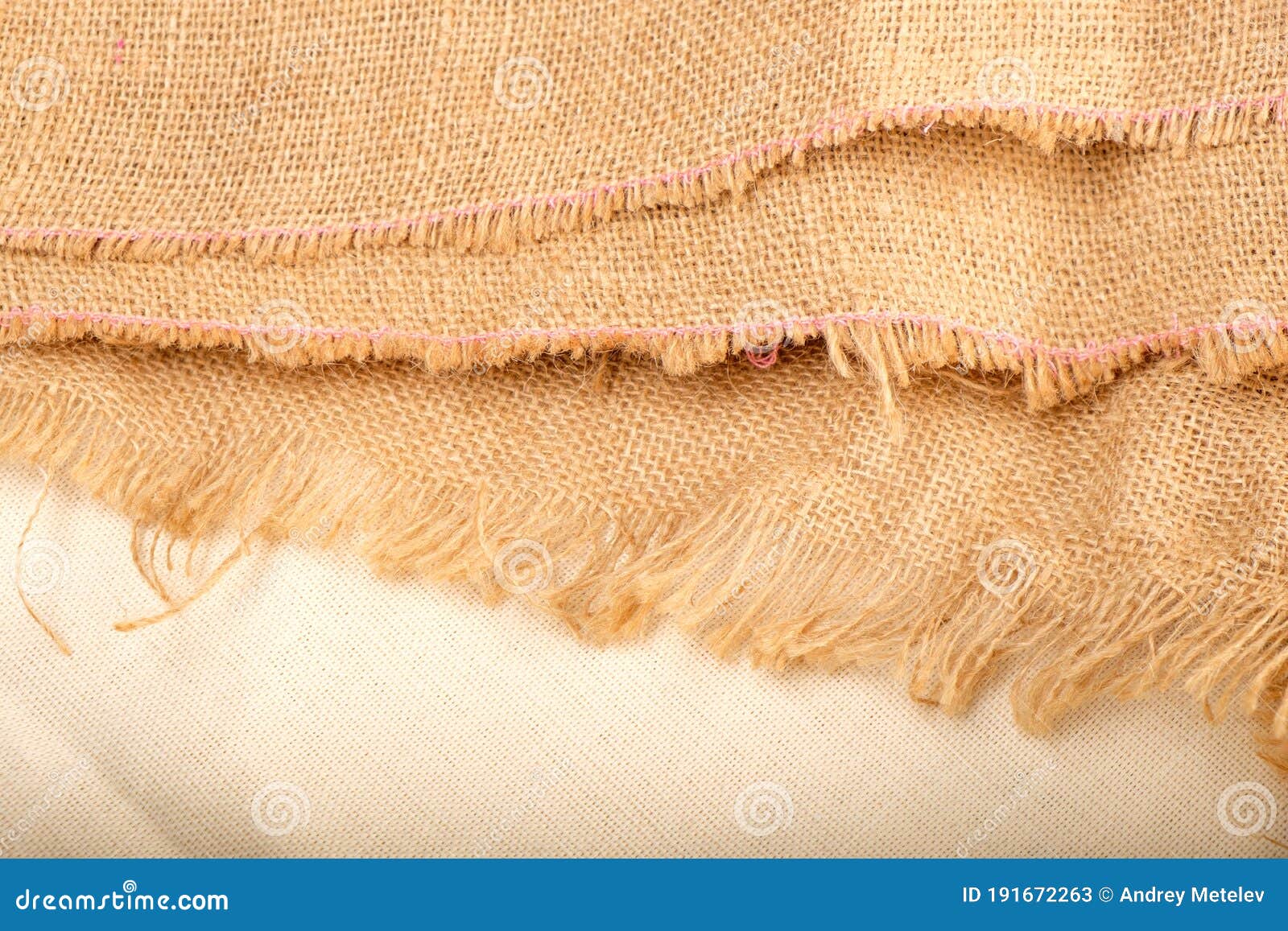 Raw Edge of Linen Fabric with Threads Sticking Out in Different