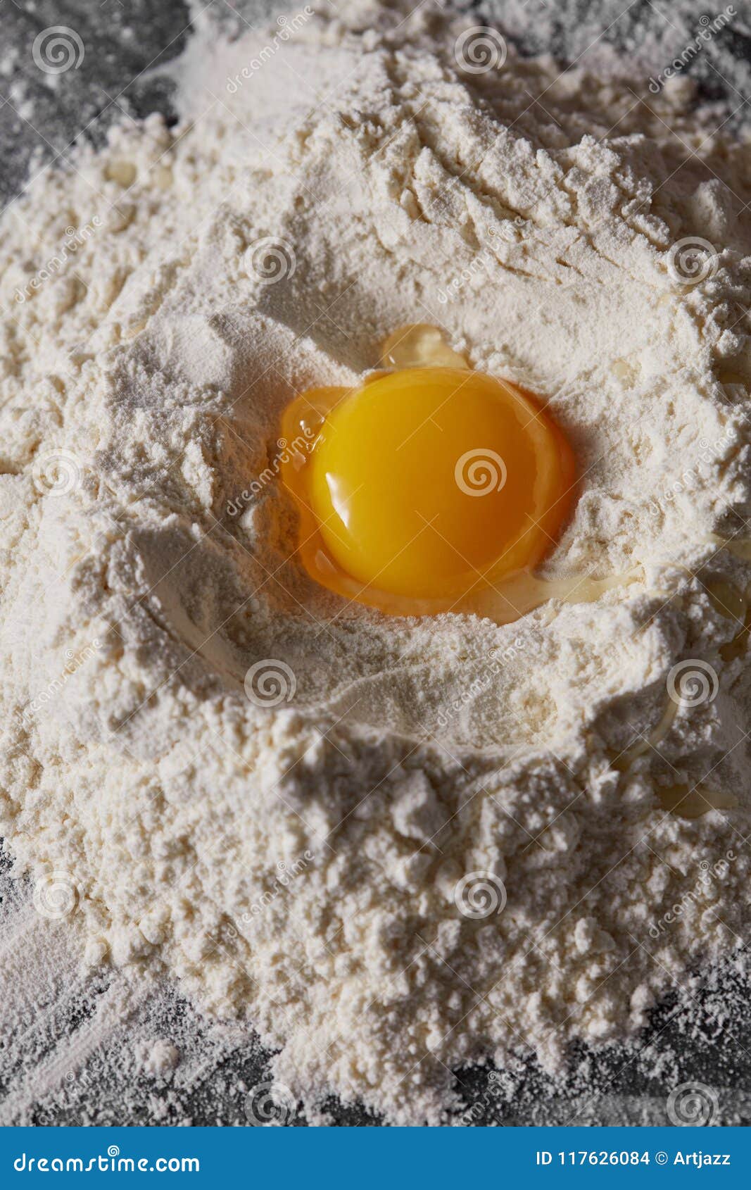 Raw Egg and Flour on the Kitchen Table, Staged Cooking Dough Stock