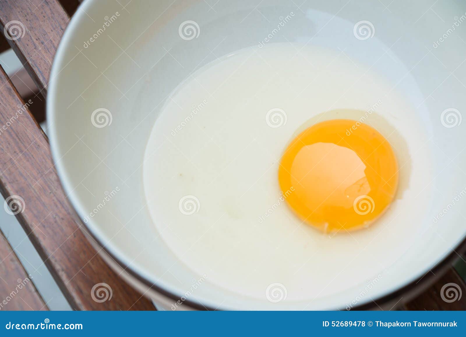Raw egg yolk on the dish stock photo. Image of cooked 52689478