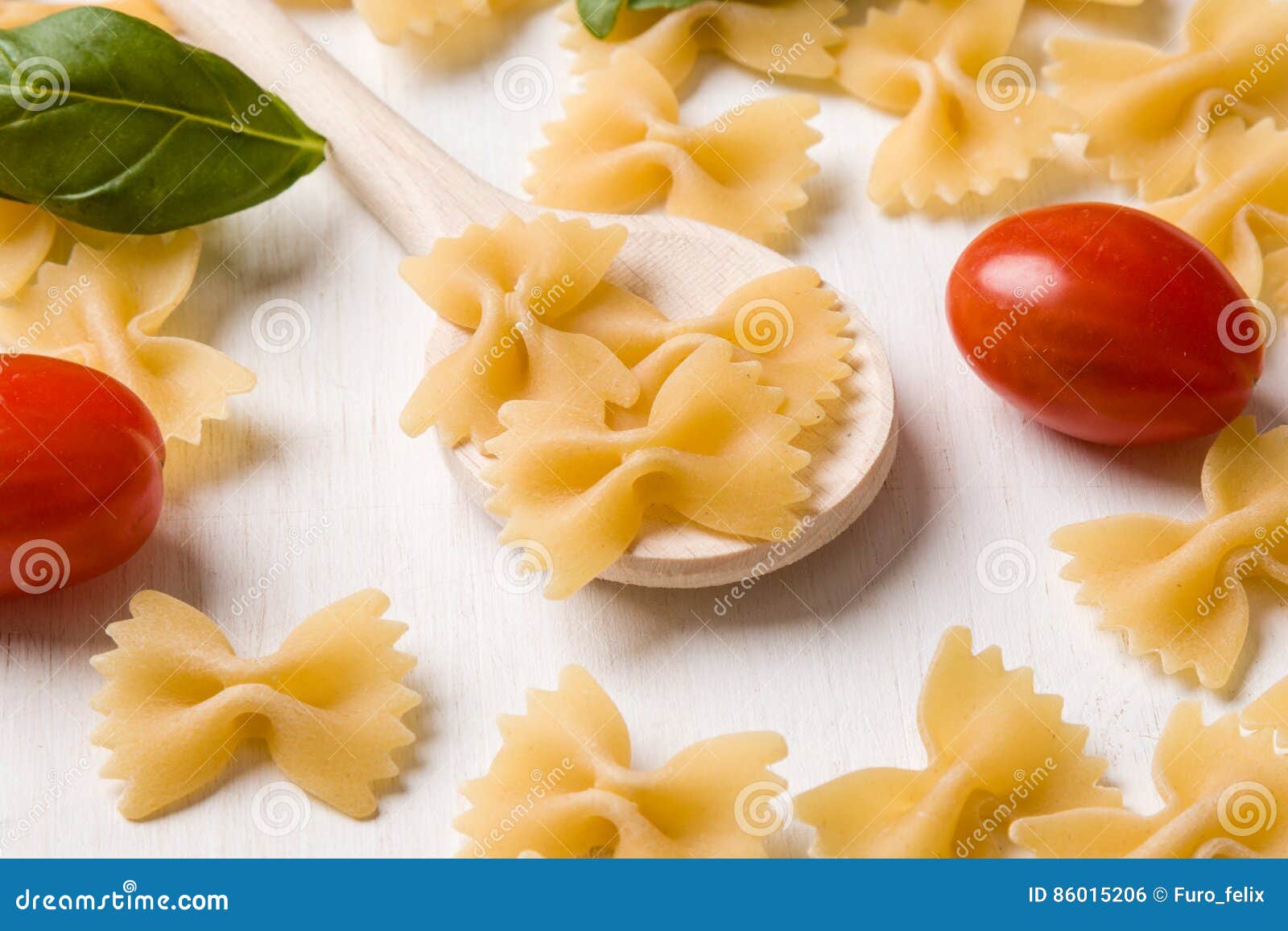 Raw farfalle bowtie pasta stock photo. Image of lunch 86015206
