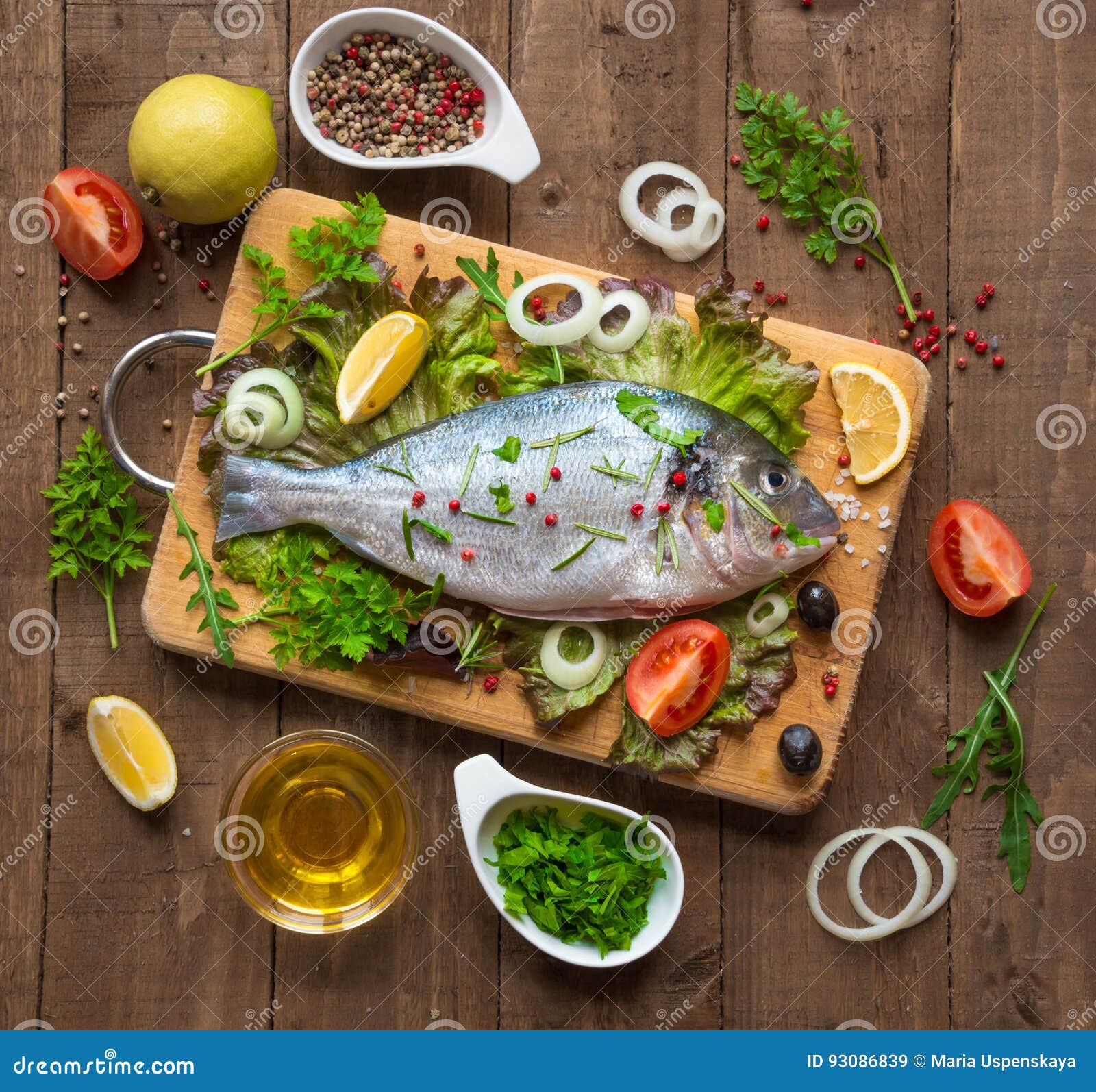 Raw fish ready for cooking stock image. Image of lemon - 93086839