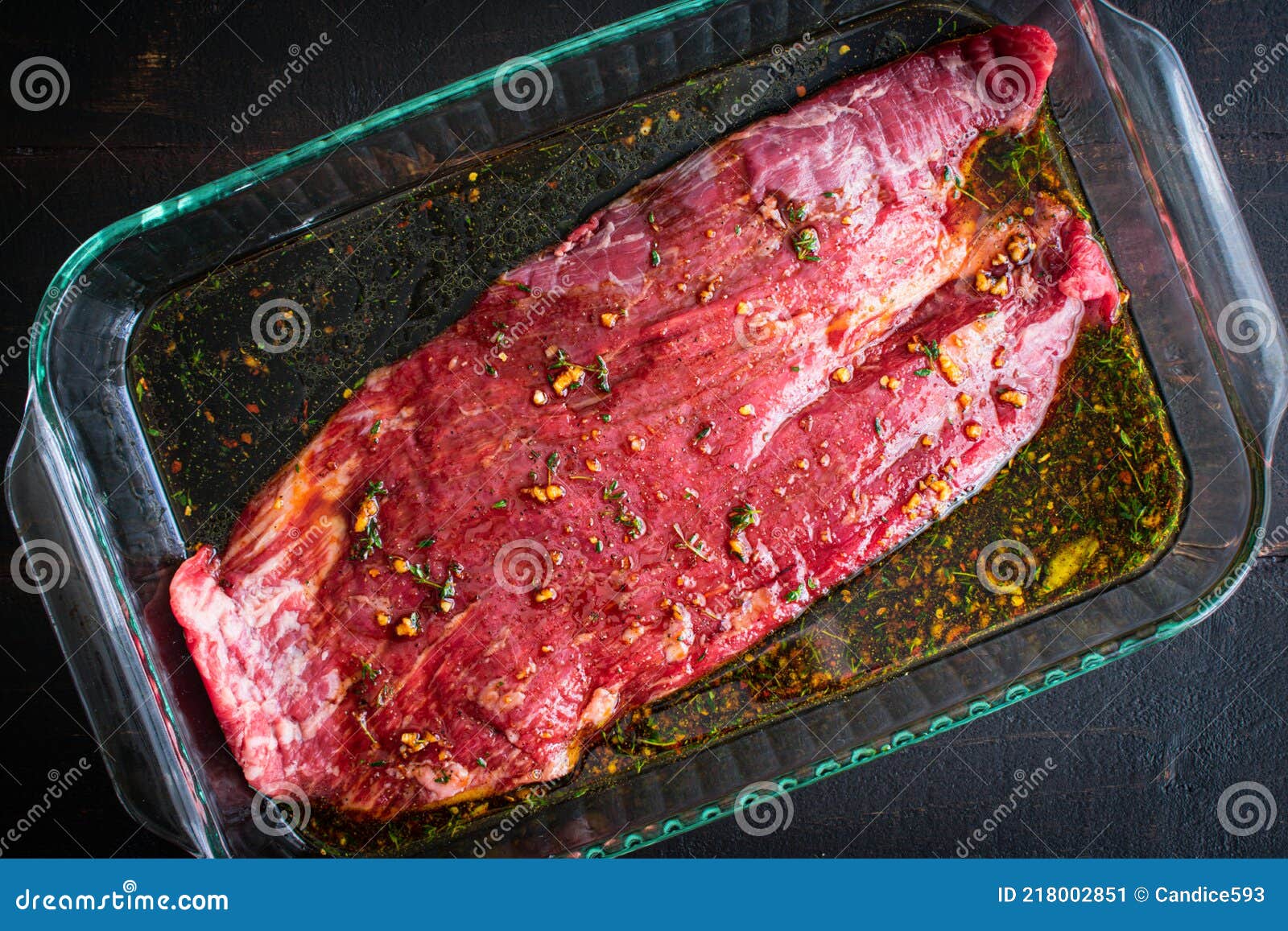 marinating flank steak in a glass dish