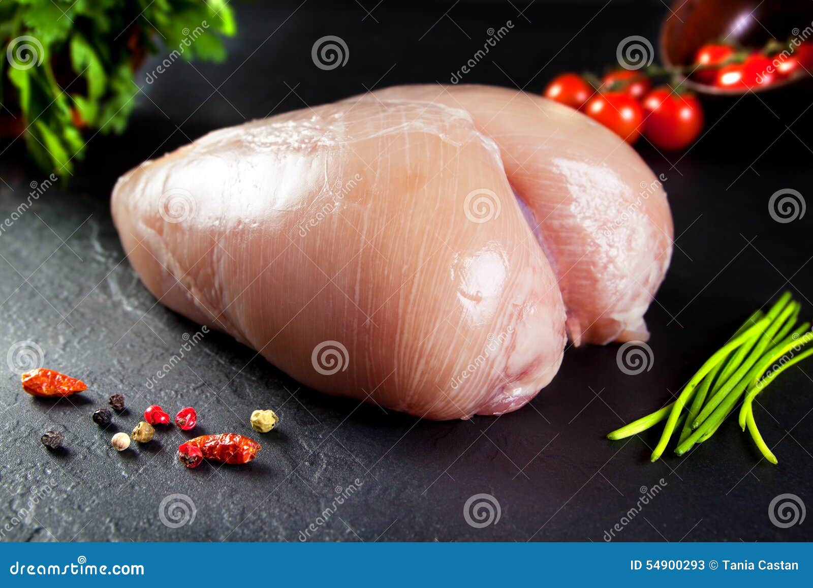 raw and fresh meat. whole chicken breast uncooked and uncut