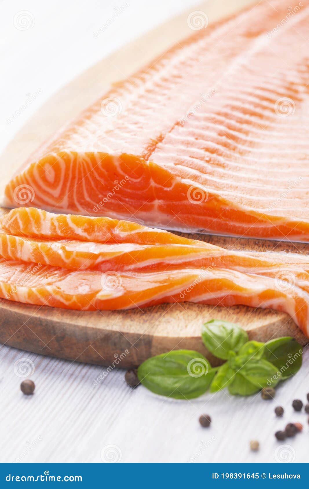 Raw Fresh Salmon Fillet Cut into Slices and Piece on Wooden Board Stock ...