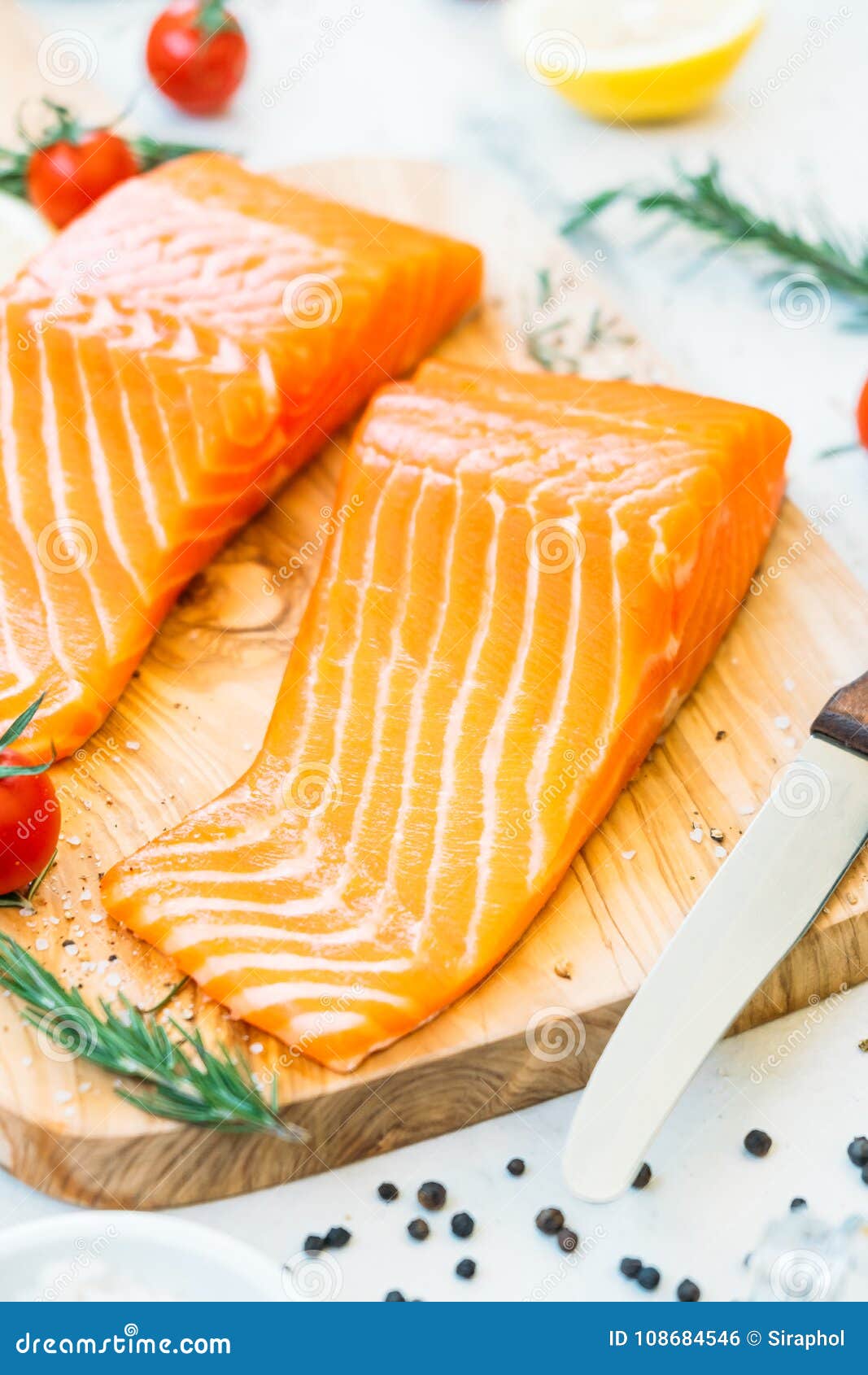 Raw and Fresh Salmon Meat Fillet on Wooden Cutting Board Stock Photo ...