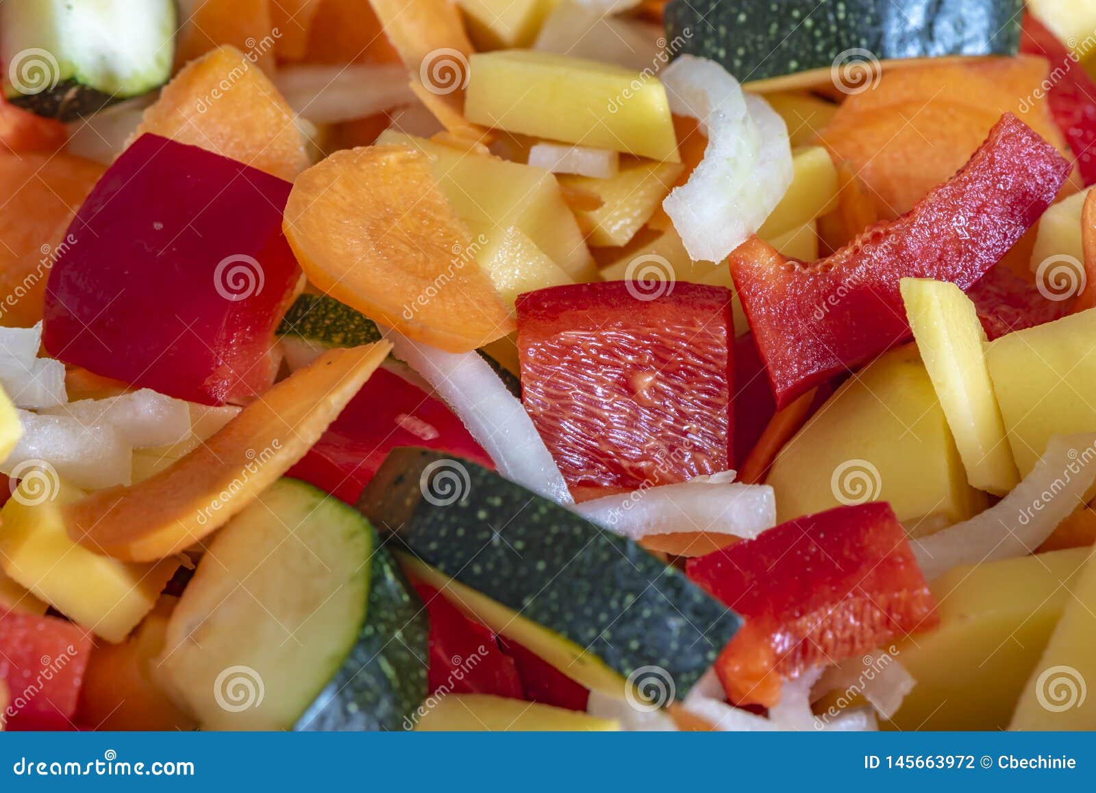 Raw Fresh Vegetables Cut and Mixed for Further Processing Stock Photo