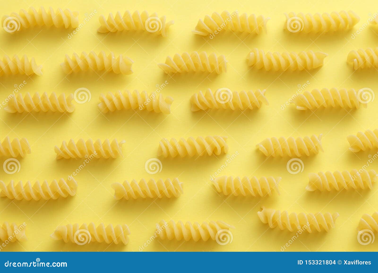 Download Raw Fusilli Pasta Over Yellow Background Stock Photo Image Of Cuisine Uncooked 153321804 Yellowimages Mockups