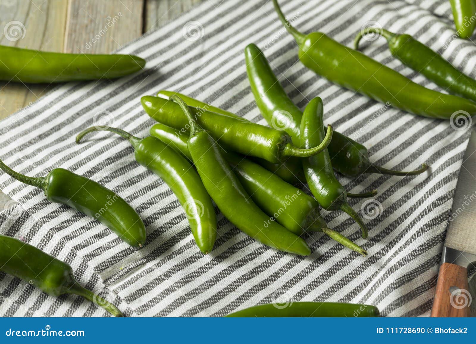 raw green organic serrano peppers
