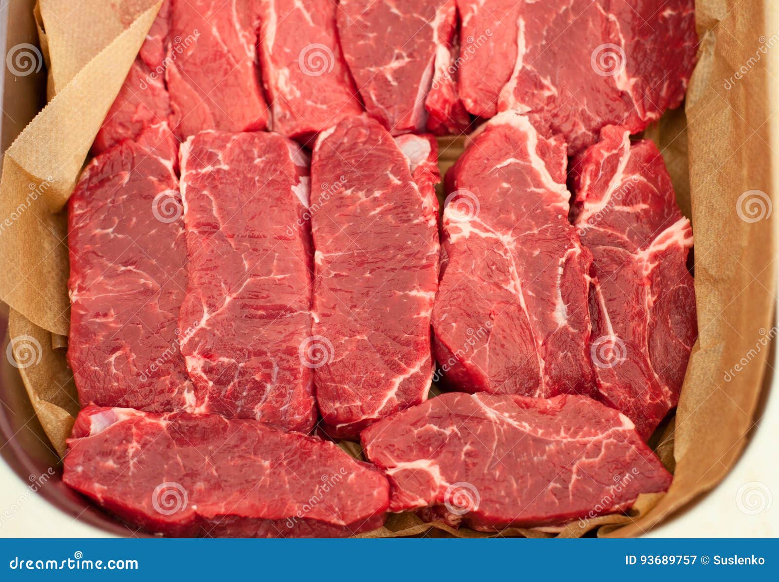 Raw Meat. Chopped Steaks from Marbled Beef on Pallet with Napkin Stock