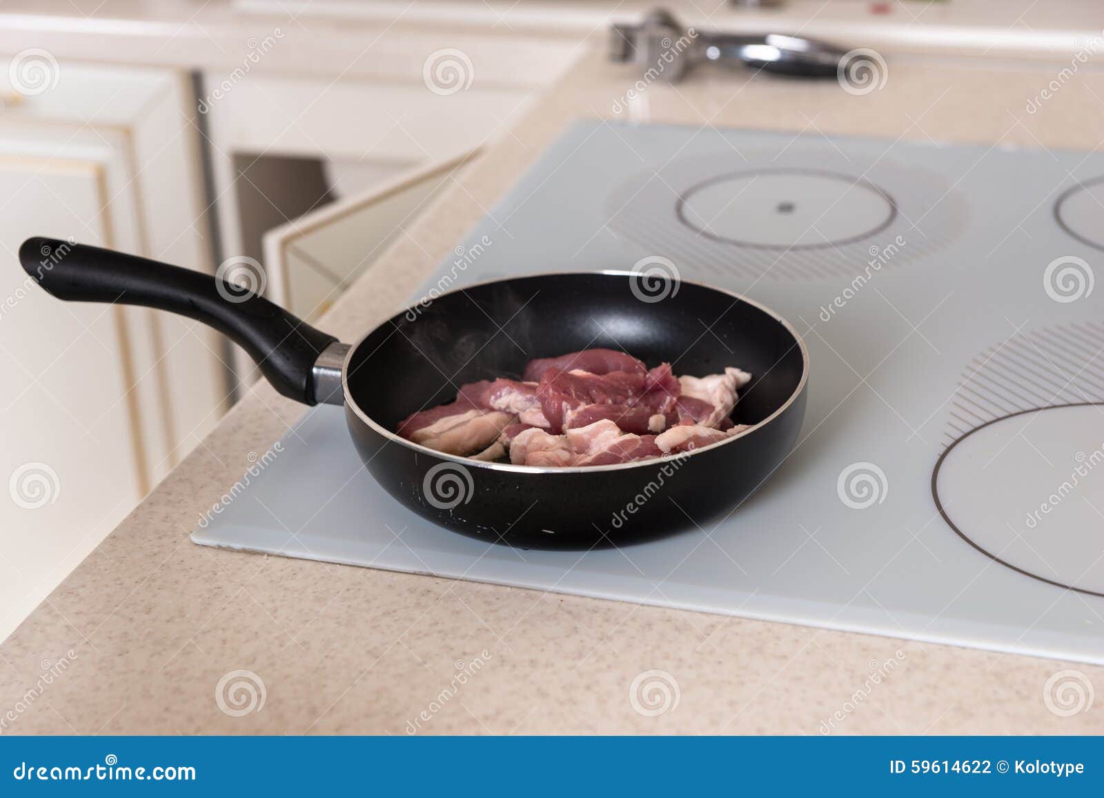 Raw Meat Cooking in Frying Pan on Stove Top Stock Photo - Image of burner,  kitchen: 59614622