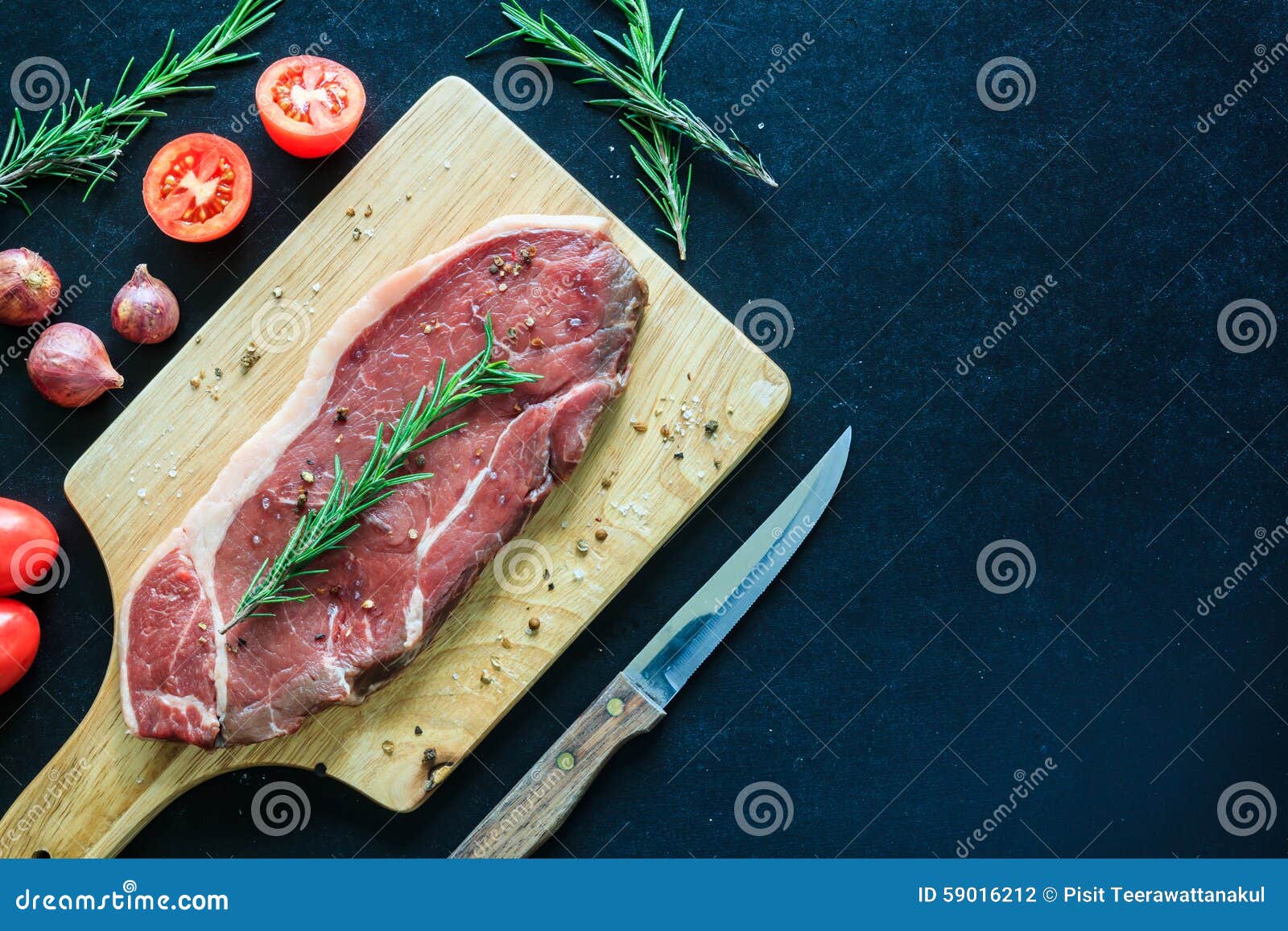 Raw Meat and Garnish on Wood Cutting Board , Space for Text Stock Photo