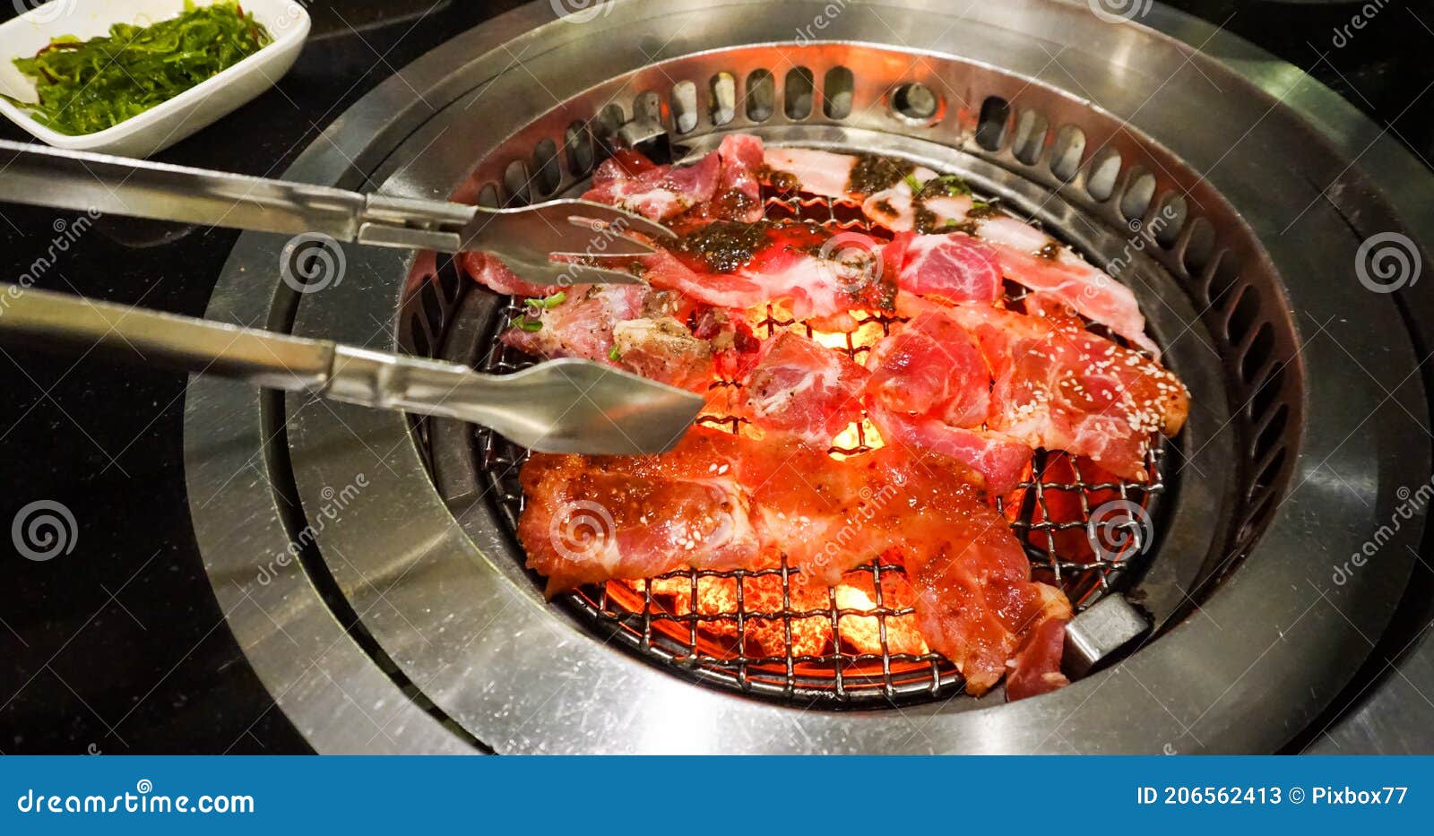 Raw meat at grill on stove stock image. Image of high 206562413