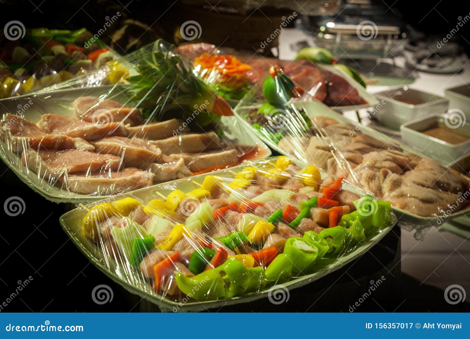 Raw meat in plastic wraps. stock image. Image of cooking 156357017