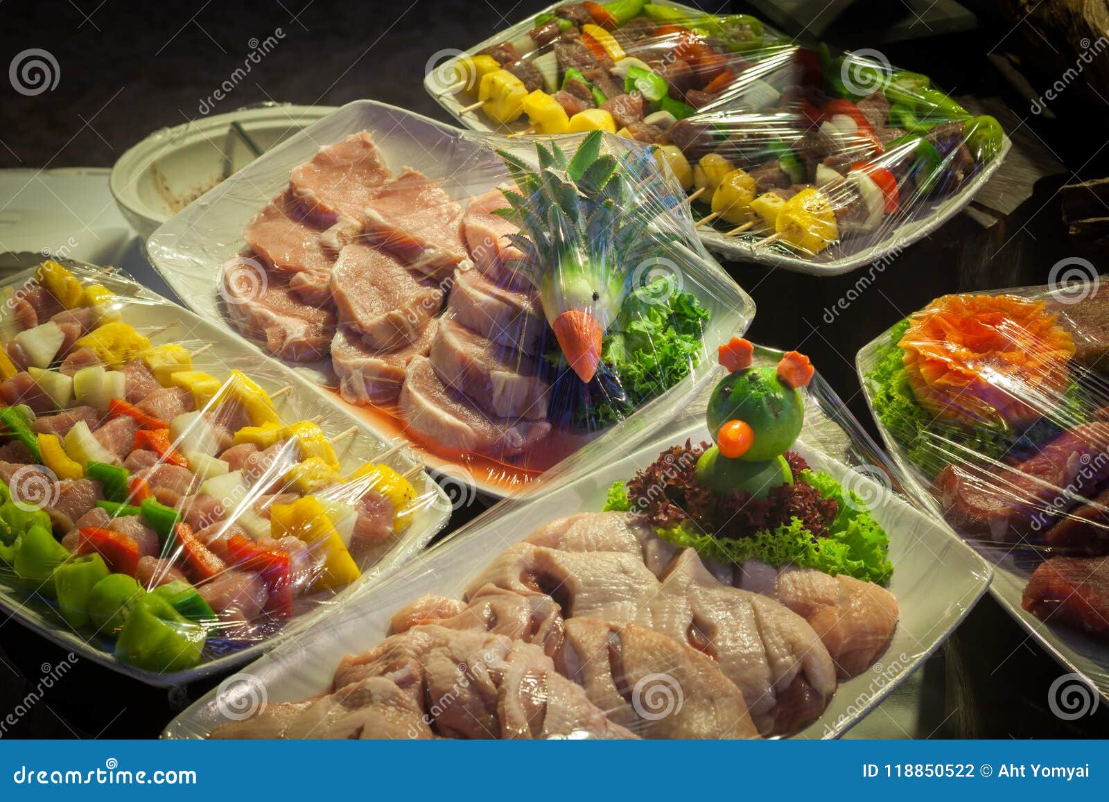 Raw meat in plastic wraps stock photo. Image of dining 118850522