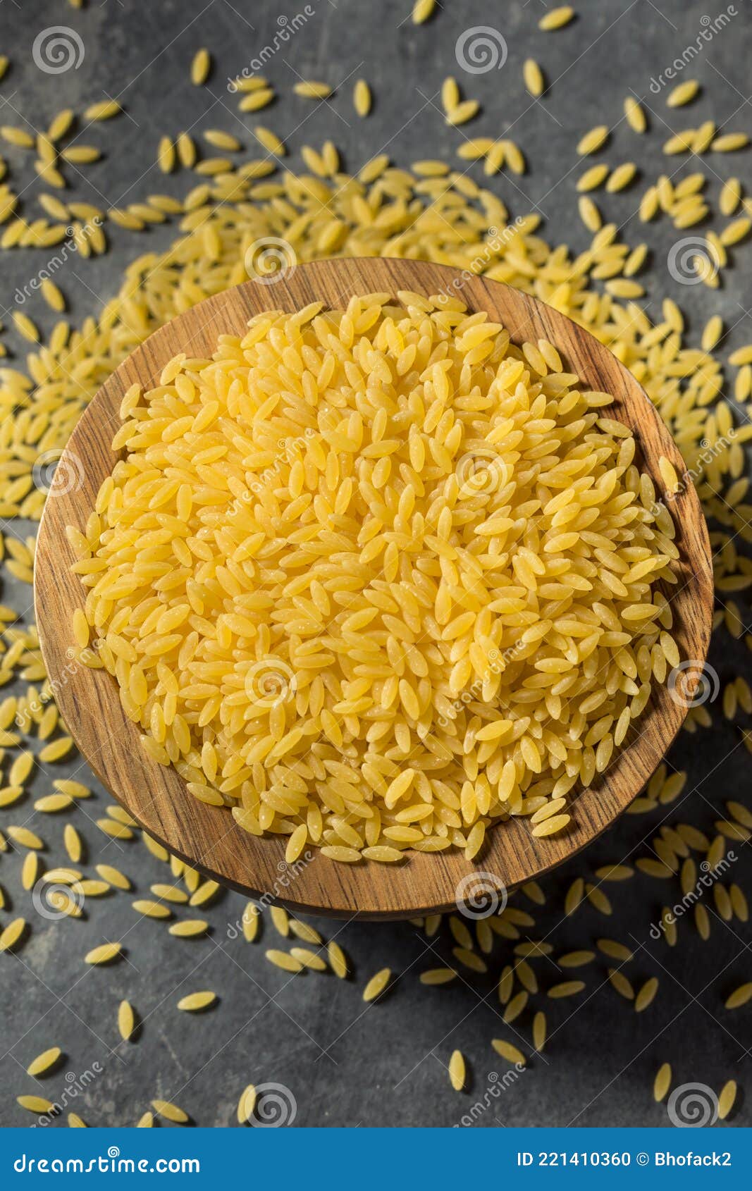 Raw Organic Dry Orzo Pasta stock photo. Image of wooden 221410360