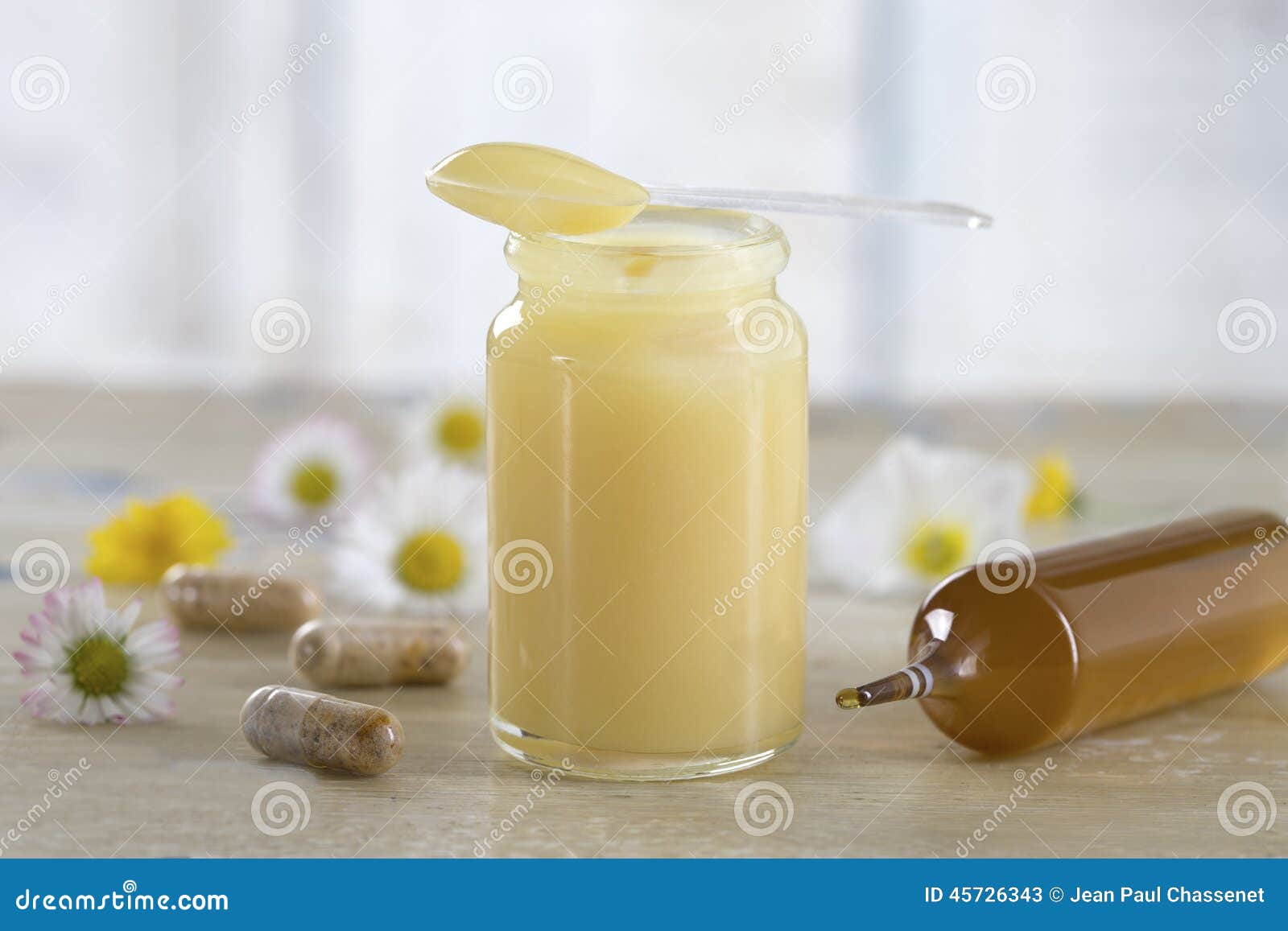 raw organic royal jelly in a small bottle