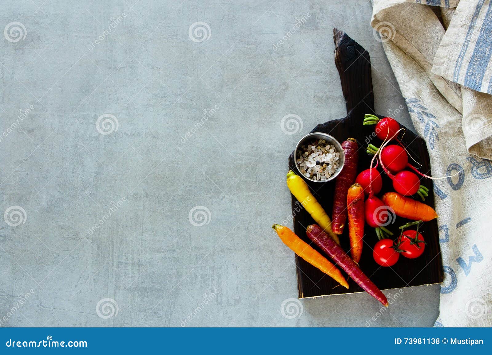 raw organic vegetables dark rustic cutting board over grey background healthy food vegetarian eating fresh harvest 73981138