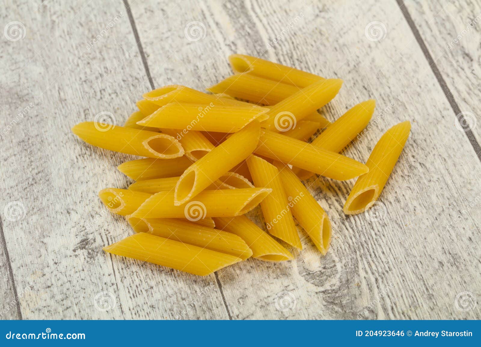 Raw penne pasta for bowl stock photo. Image of culture 204923646