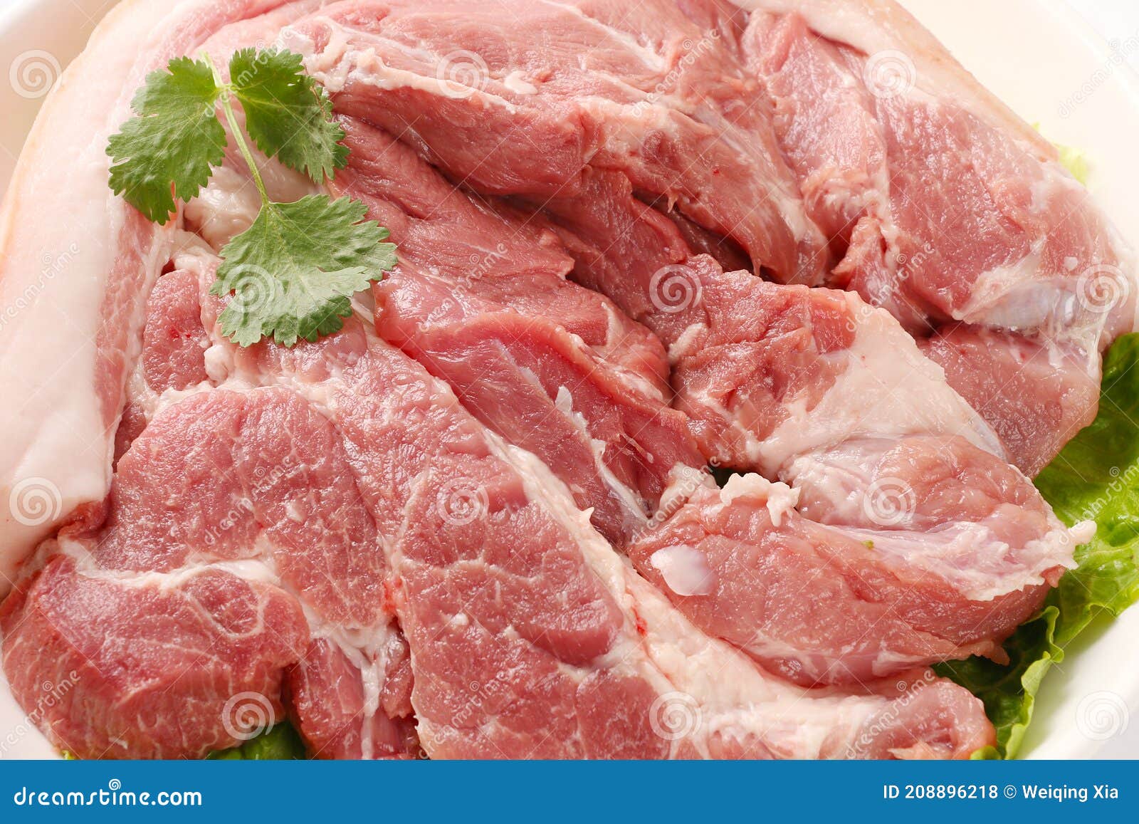 slices of pork with rosemary  on white background